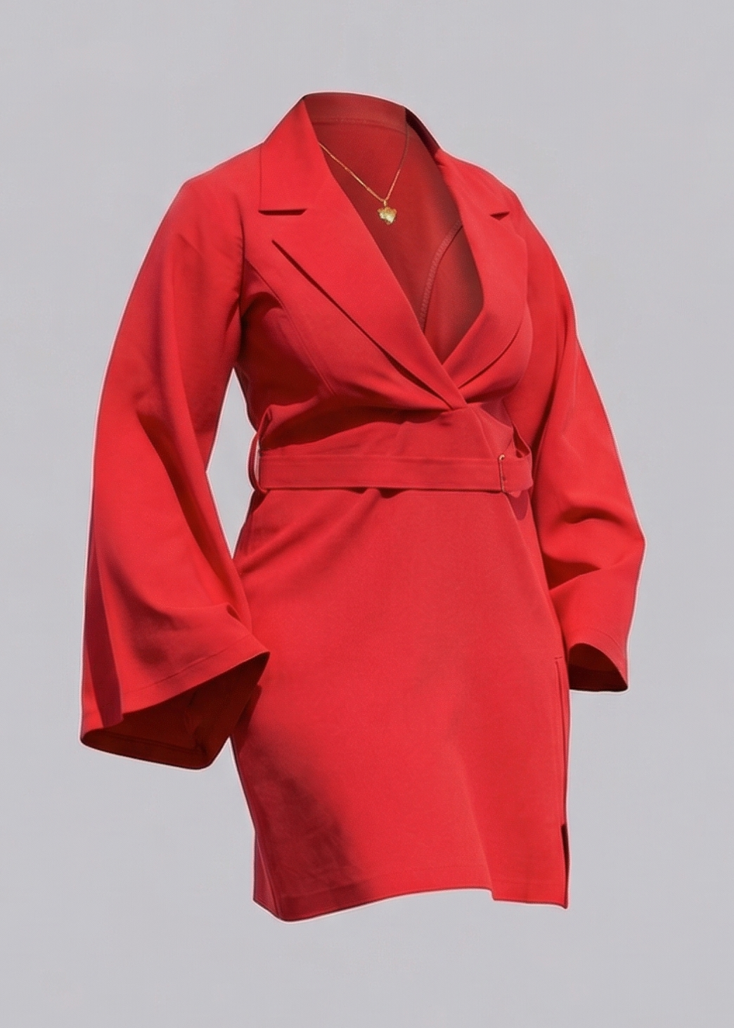 Red dress with a necklace and high heels on a gray background
